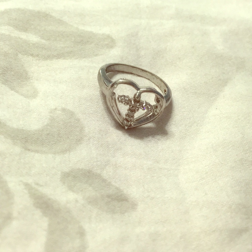 Diamond encrusted cross ring